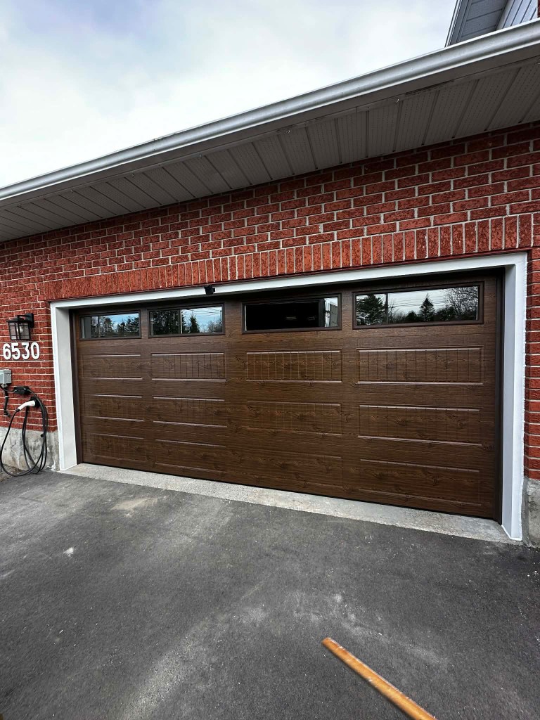 New 16x7 garage door with windows installed in Greely
