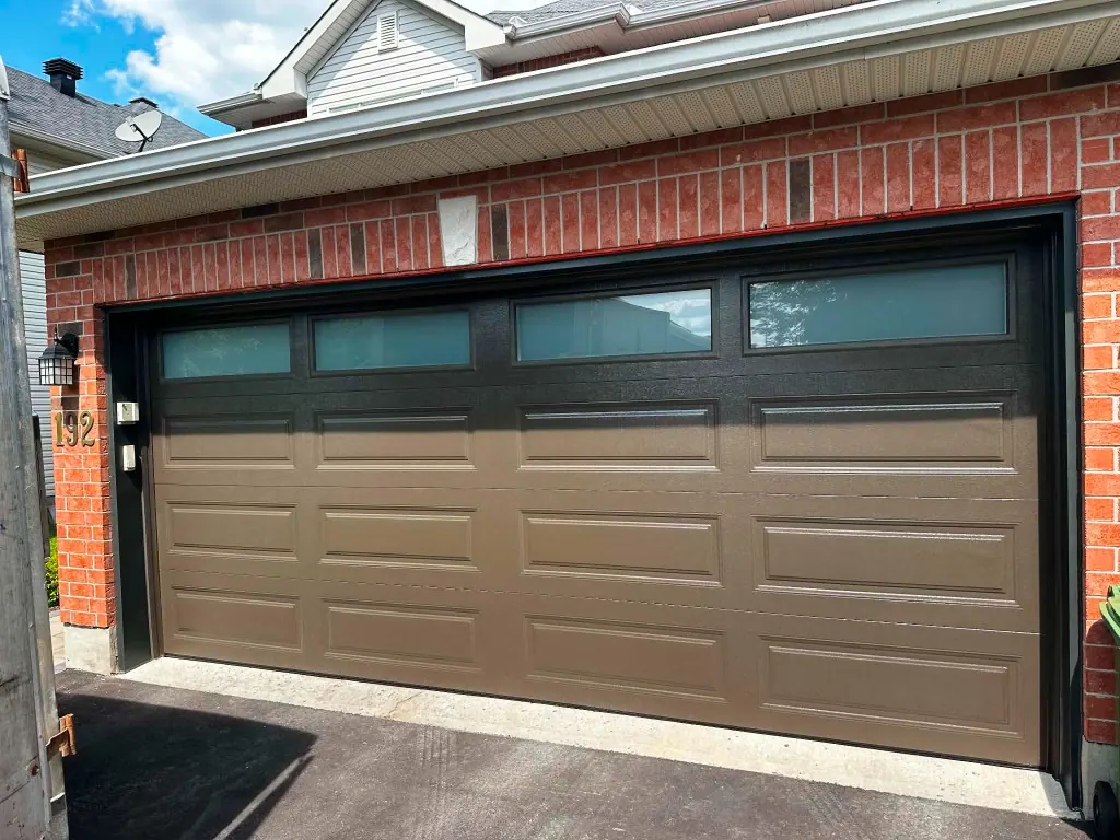 New 16x7 brown garage door with windows installed in Kanata, Ottawa