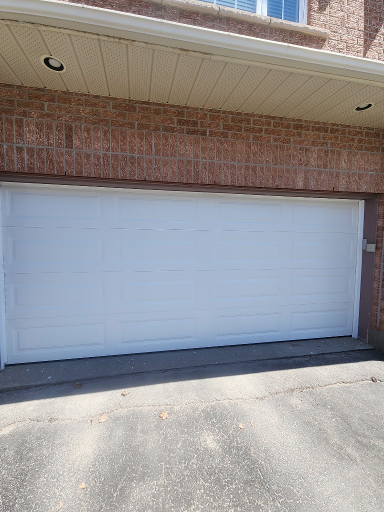 New 16x7 white garage door installation in Kanata, Ottawa