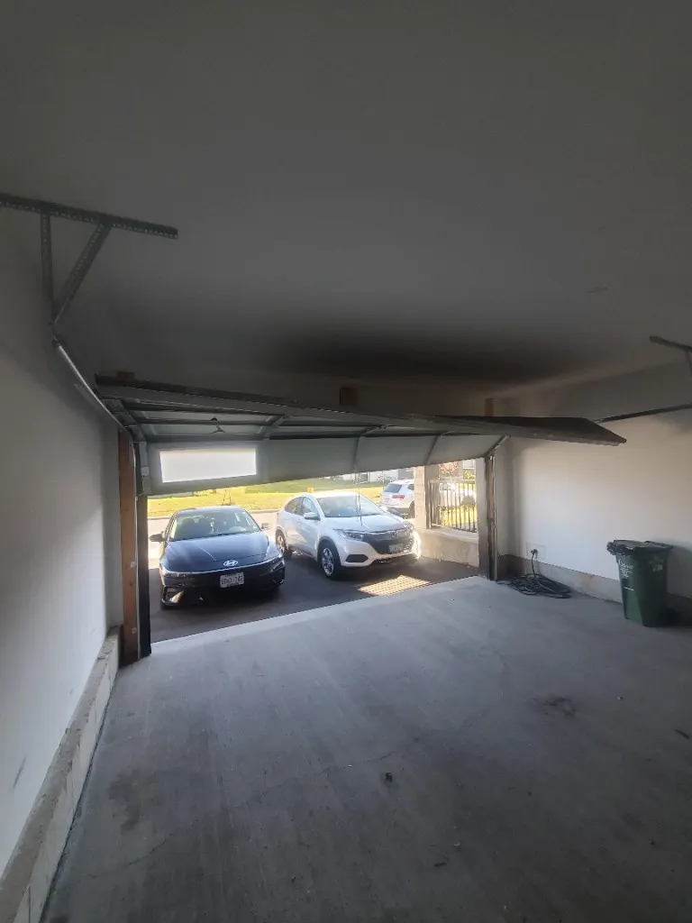 Garage door off track and crooked in Greely — emergency repair