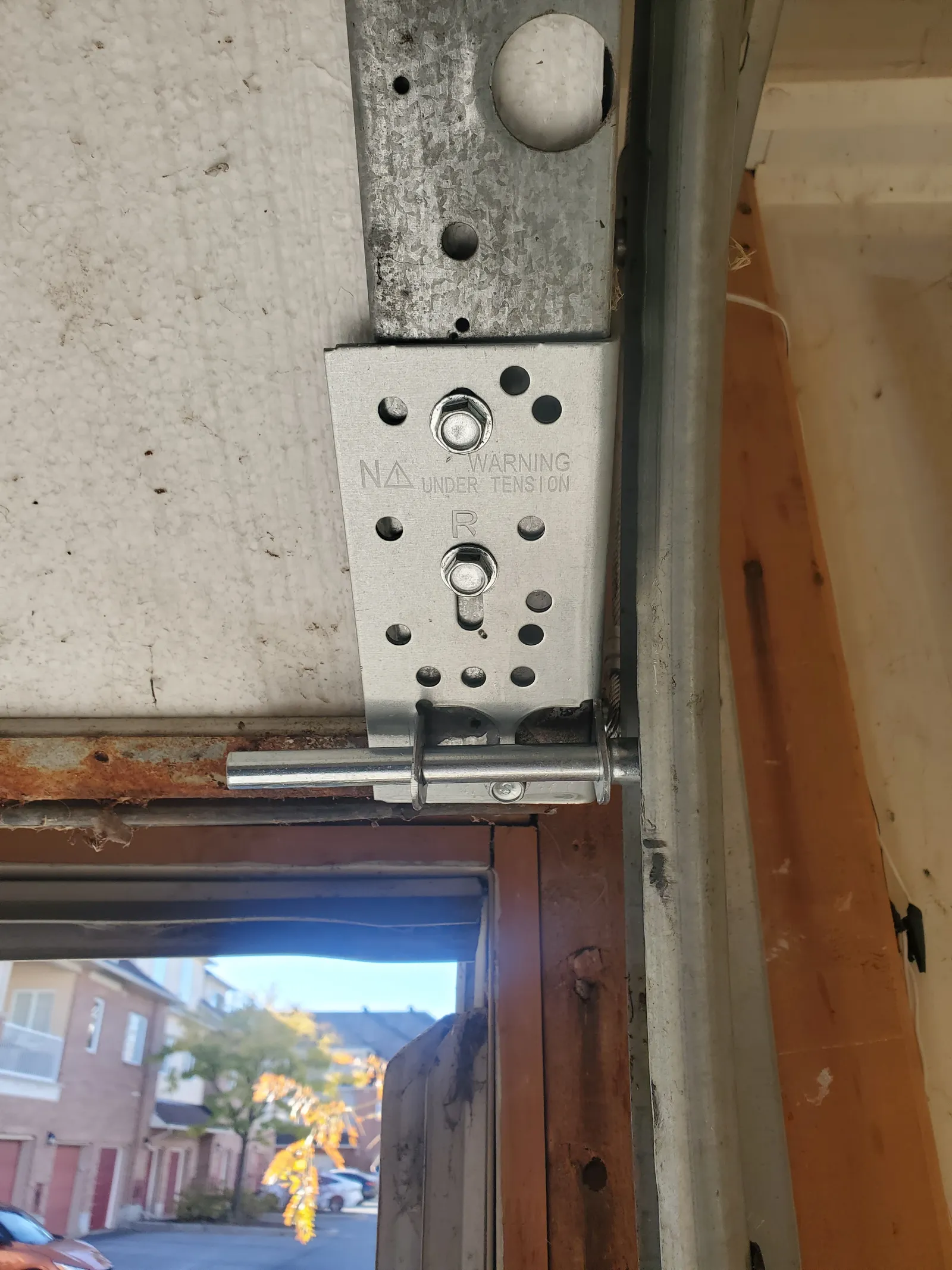 New galvanized garage door bottom bracket and roller installed in Kanata